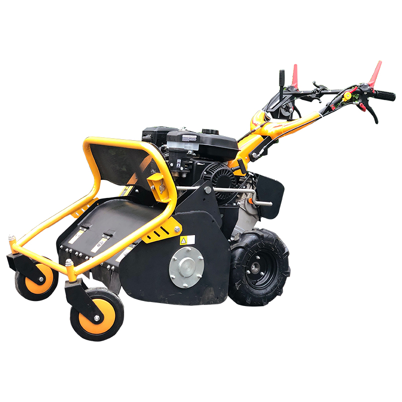 Heavy duty flail mower cutting brush in the field
